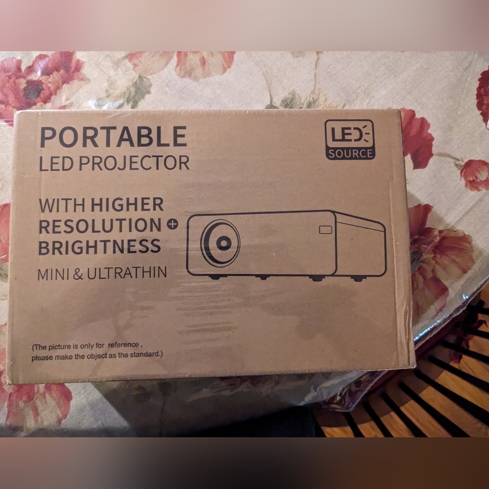 Mini movie projector New with lightning to HDMI cable